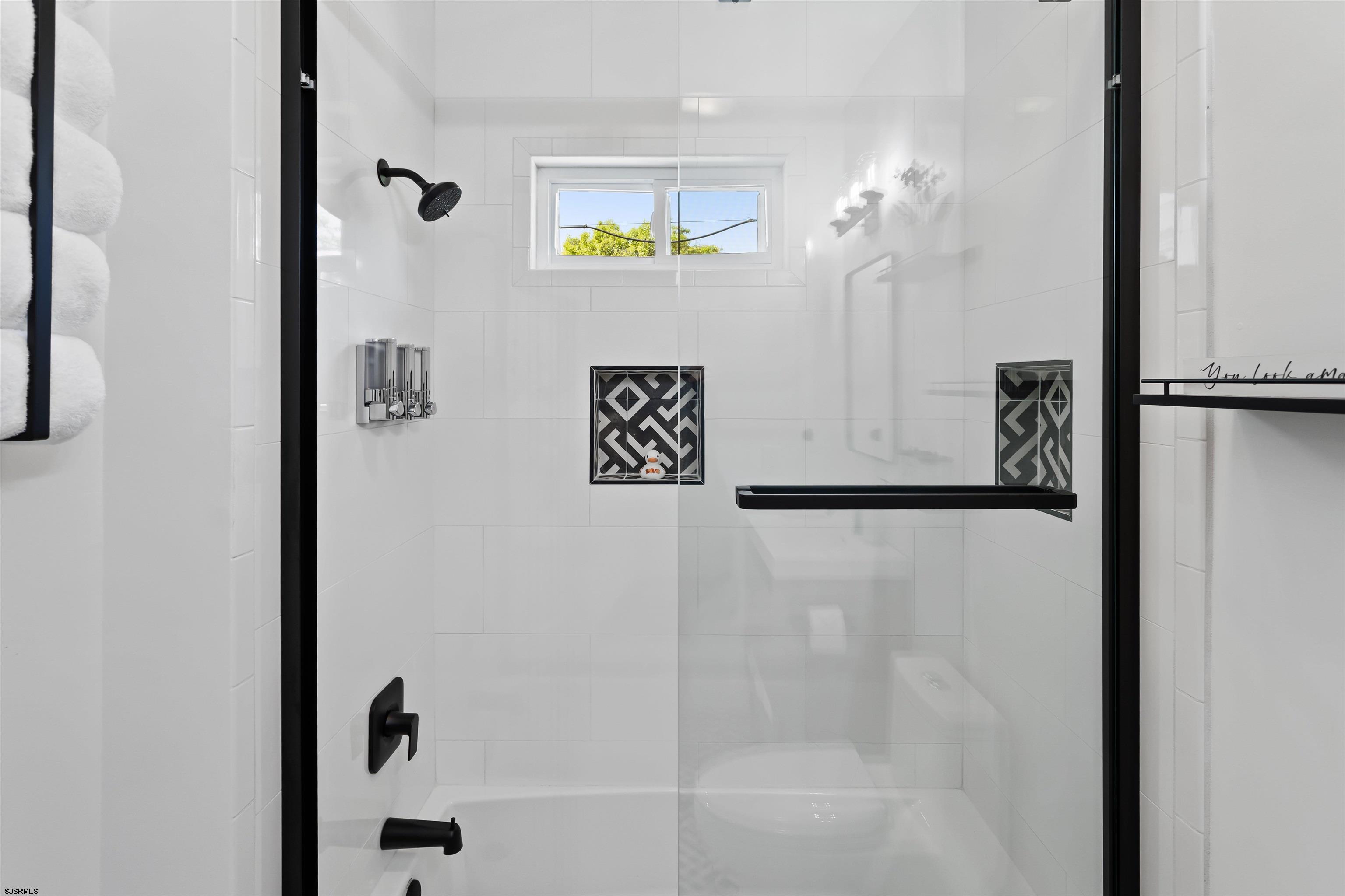 1 South Delancy Place, Unit 1 Atlantic City, NJ 08401 - Photo 30 of 35 a bathroom with a bathtub and a shower