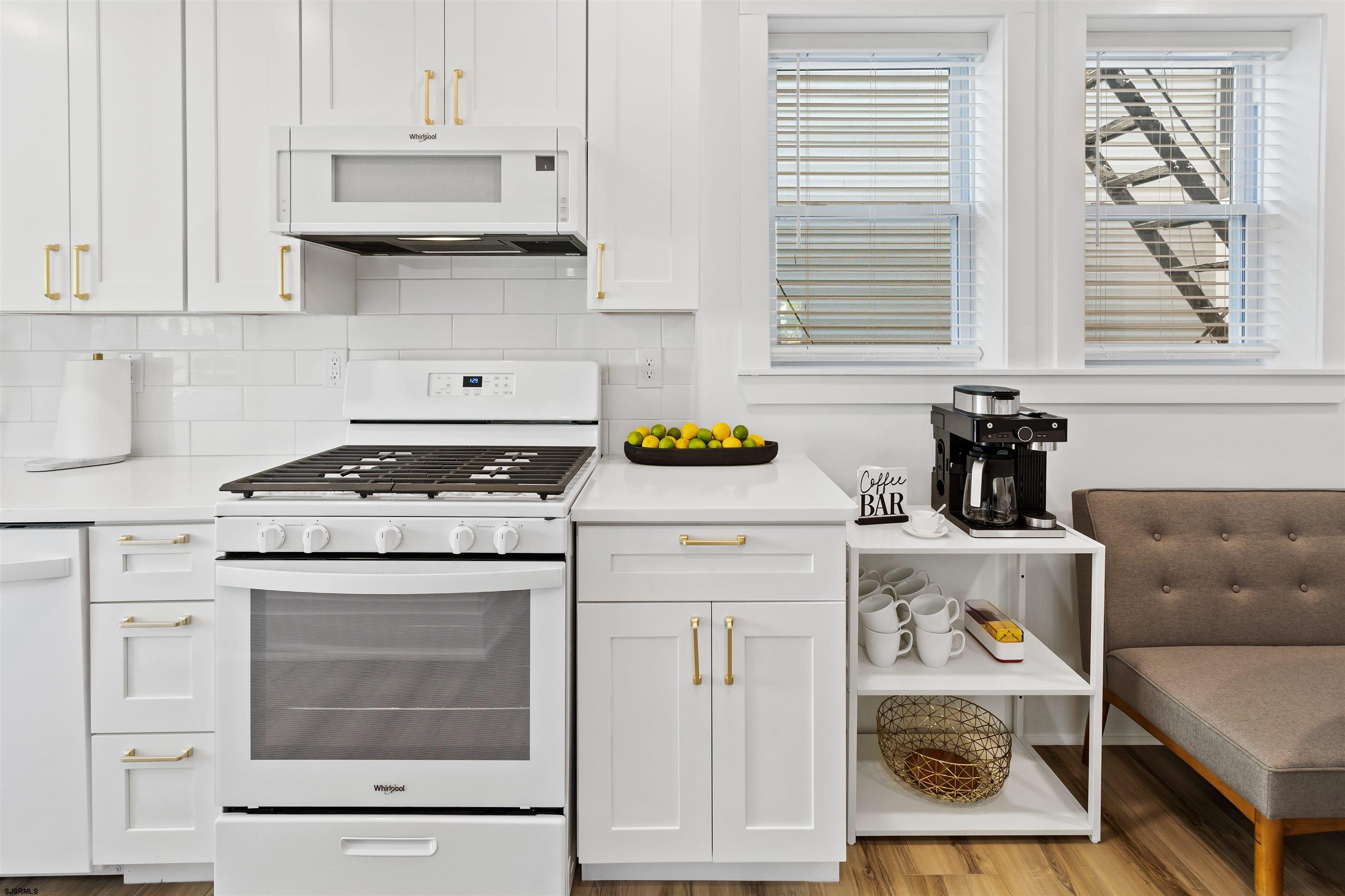 1 South Delancy Place, Unit 1 Atlantic City, NJ 08401 - Photo 31 of 35 a kitchen with a stove and a cabinets