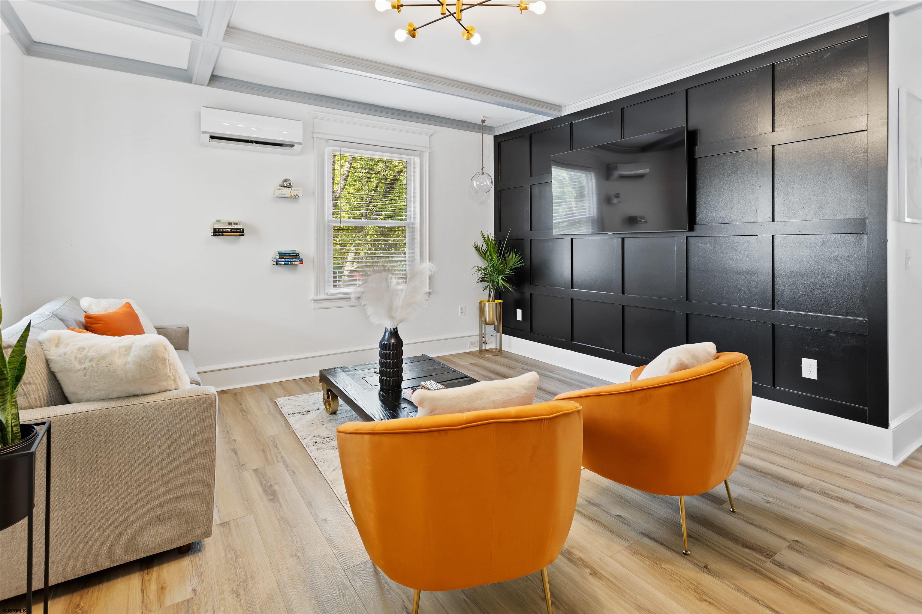 1 South Delancy Place, Unit 1 Atlantic City, NJ 08401 - Photo 7 of 35 a living room with furniture and a potted plant