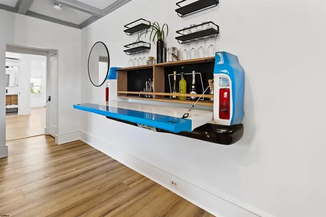 a view of living room with furniture and a fireplace