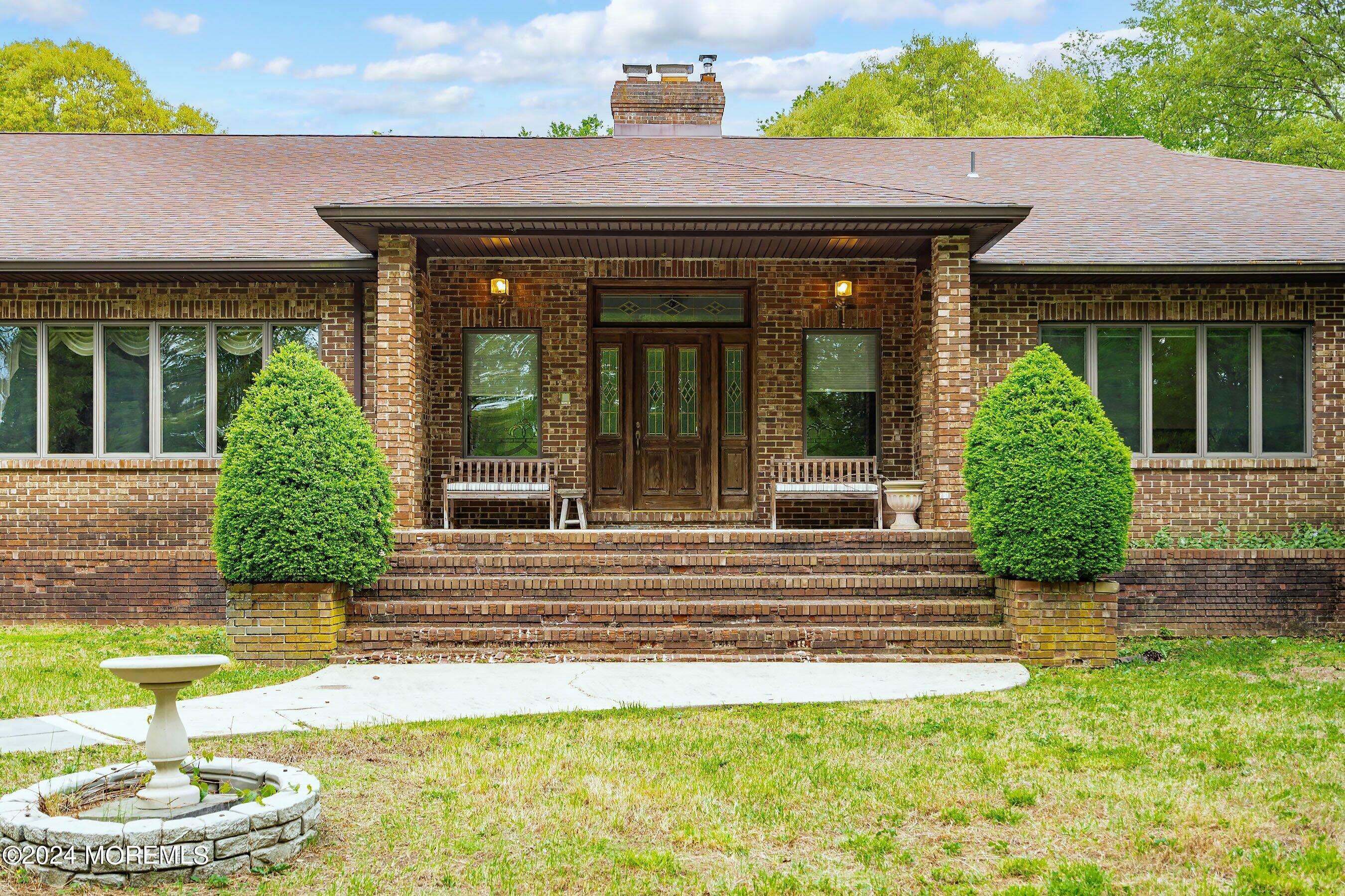 859 Monmouth Road Cream Ridge, NJ 08514 - Photo 1 of 50 a view of a house with a garden