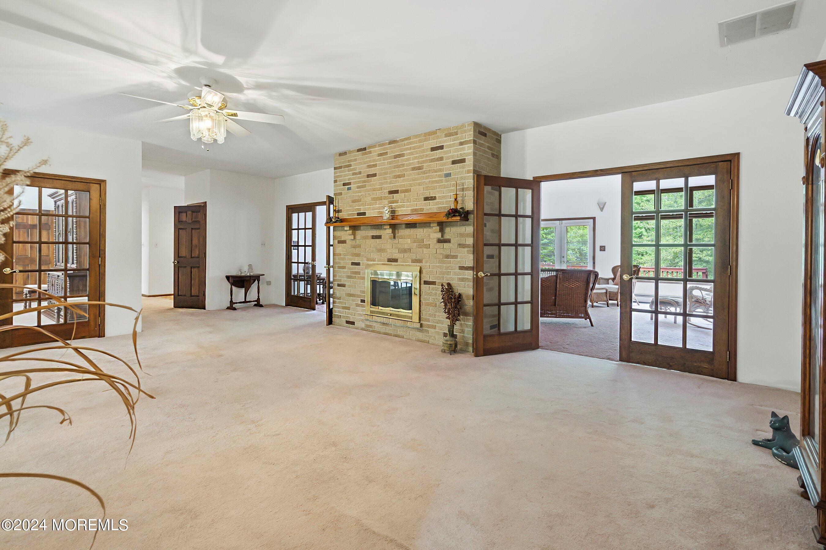 859 Monmouth Road Cream Ridge, NJ 08514 - Photo 14 of 50 an empty room with ceiling fan and windows