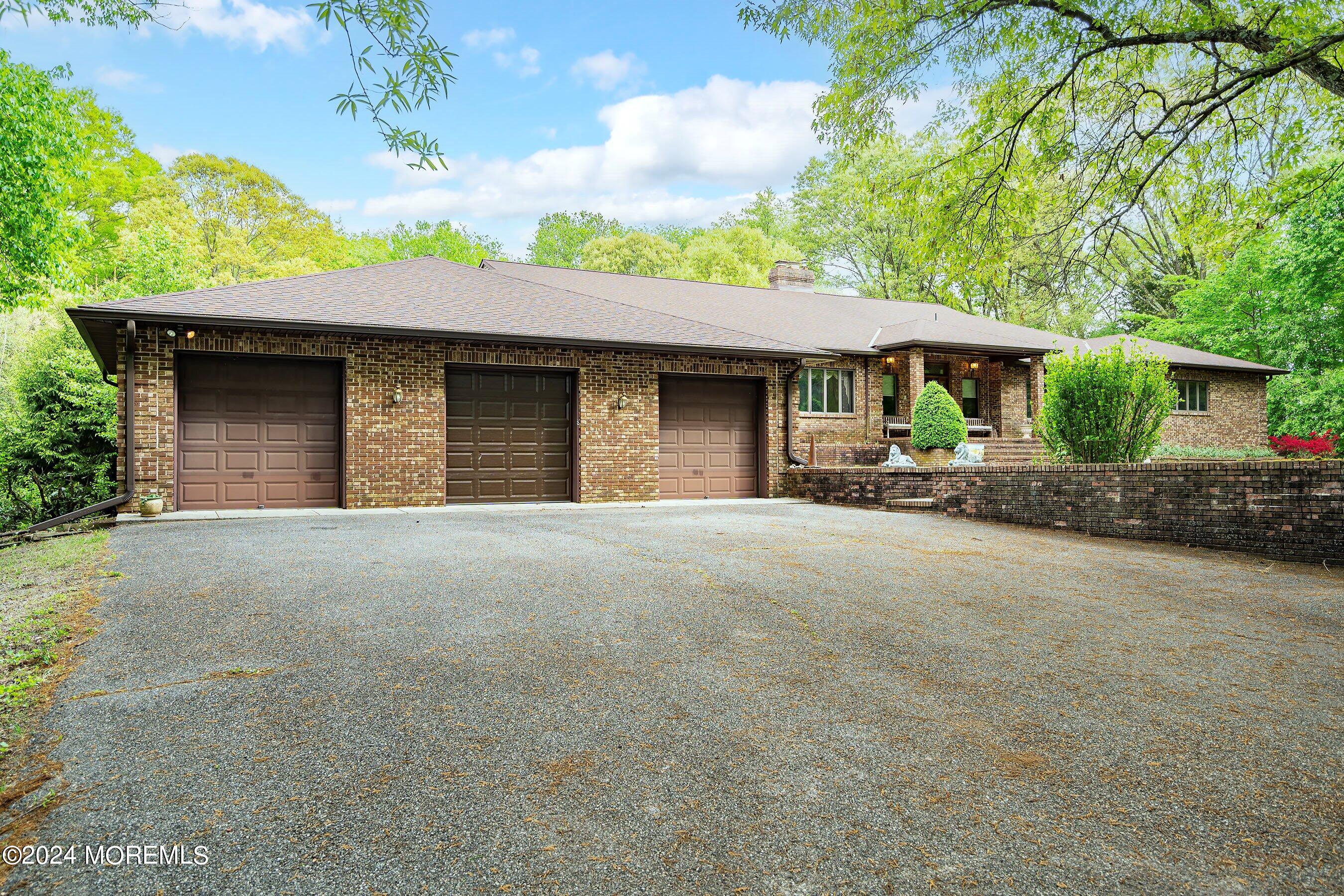 859 Monmouth Road Cream Ridge, NJ 08514 - Photo 2 of 50 a house view with a garden space