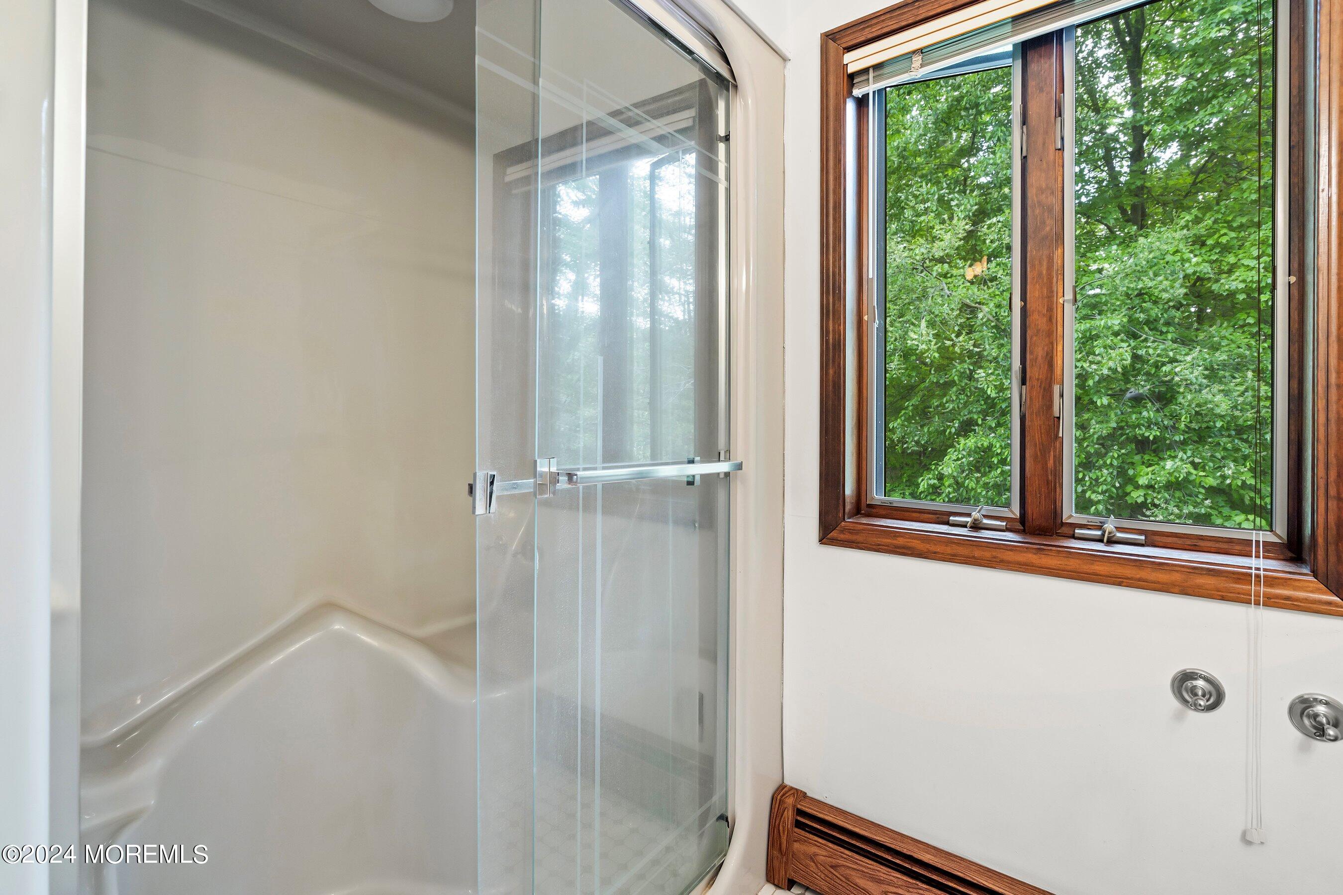859 Monmouth Road Cream Ridge, NJ 08514 - Photo 22 of 50 a view of a bathroom with a glass door