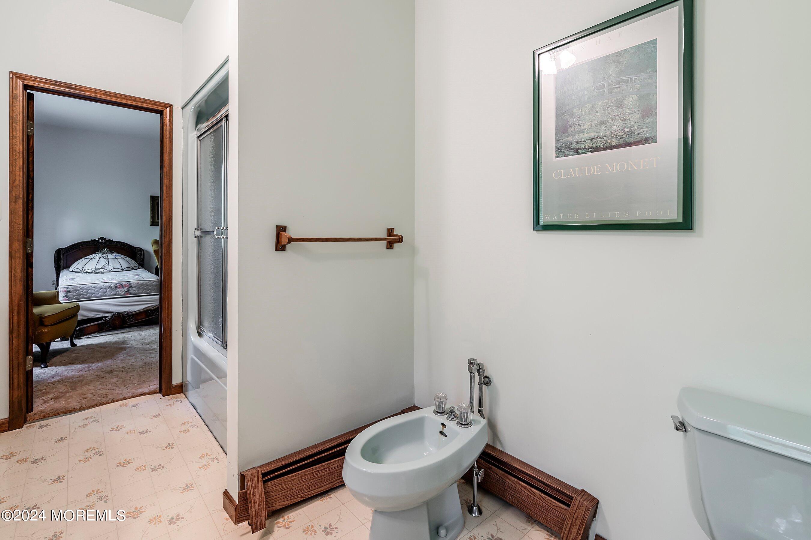 859 Monmouth Road Cream Ridge, NJ 08514 - Photo 26 of 50 a bathroom with a toilet and a vanity