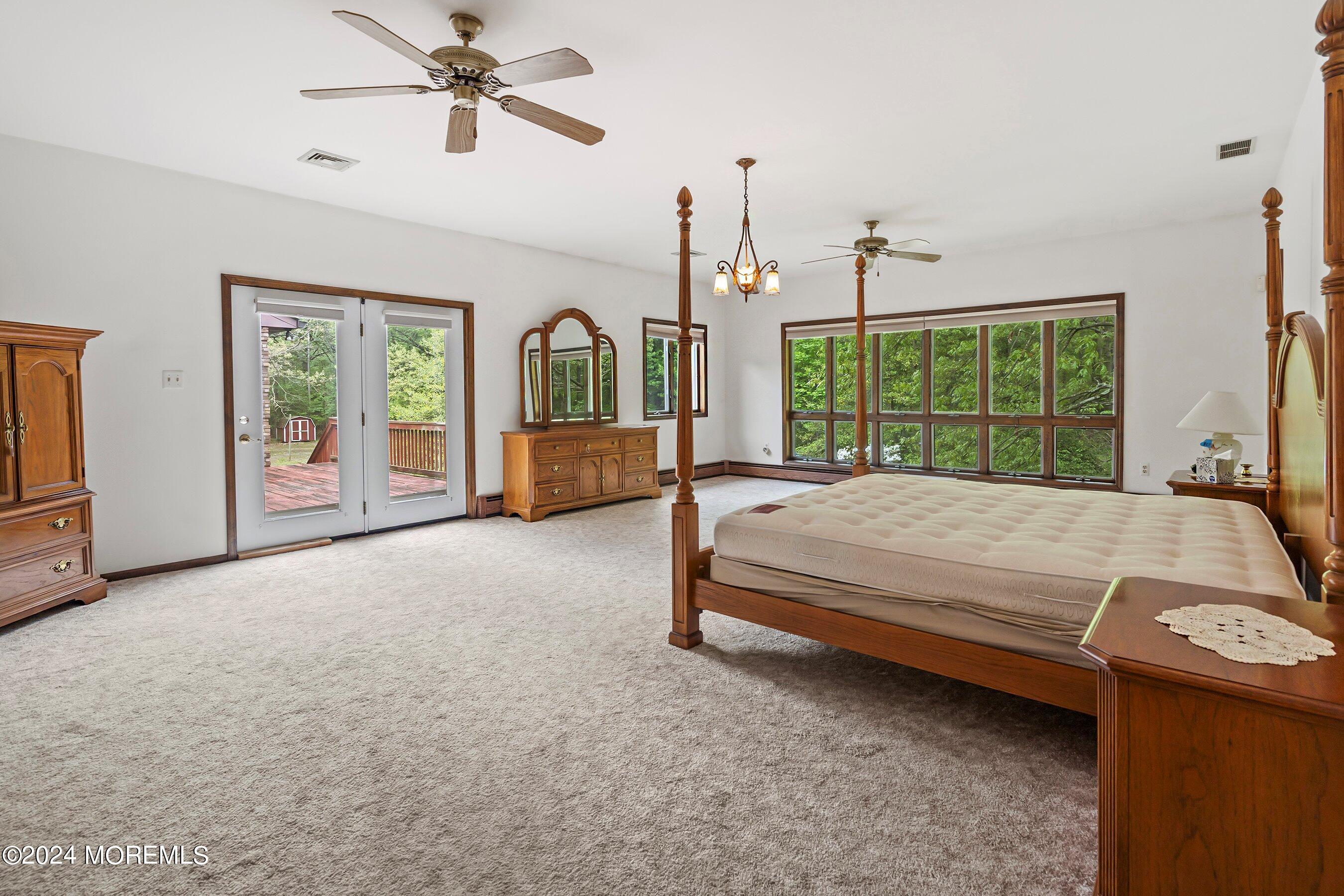 859 Monmouth Road Cream Ridge, NJ 08514 - Photo 27 of 50 a bed sitting in a spacious bedroom next to a window