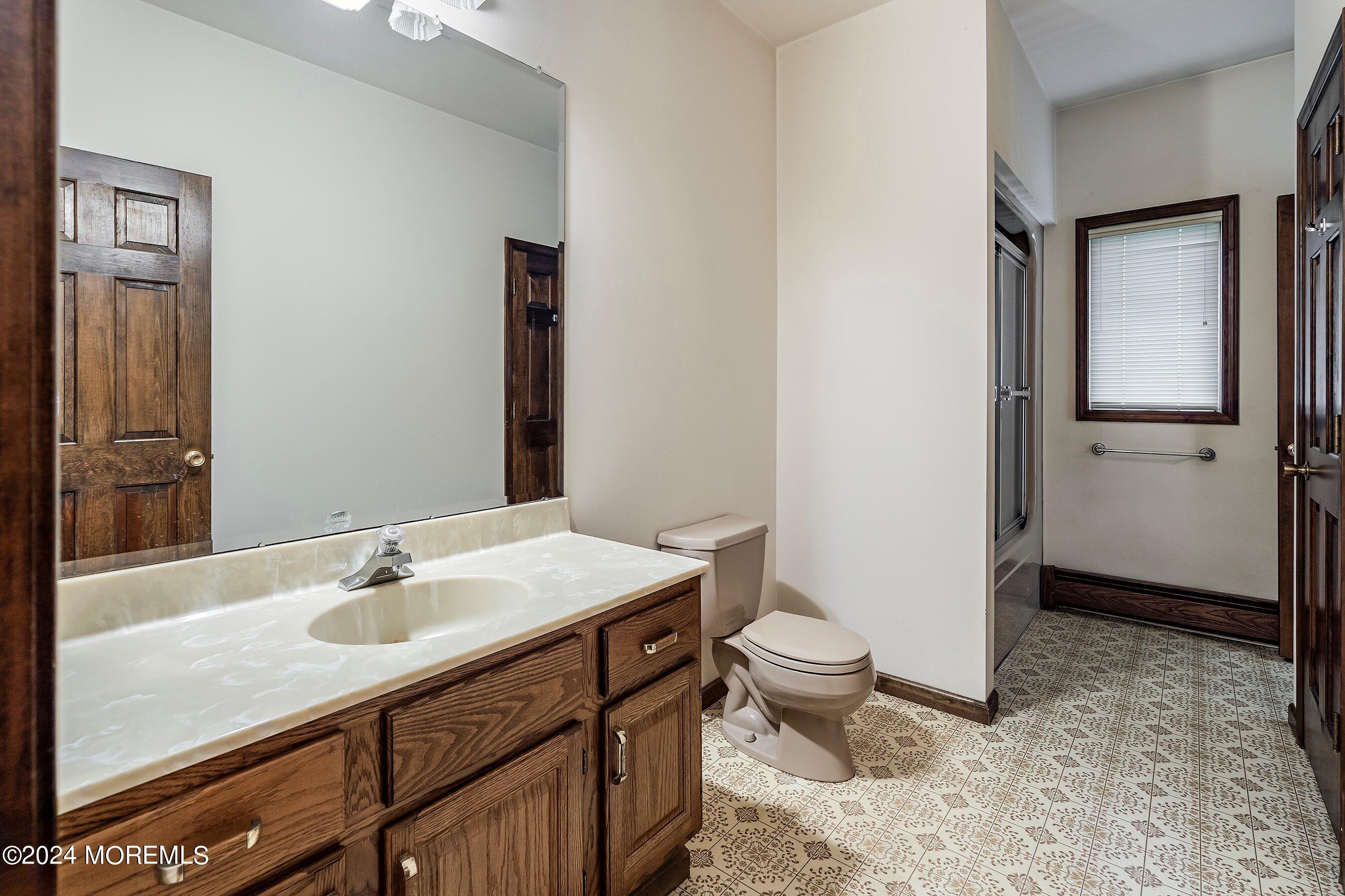 859 Monmouth Road Cream Ridge, NJ 08514 - Photo 32 of 50 a bathroom with a sink toilet and shower
