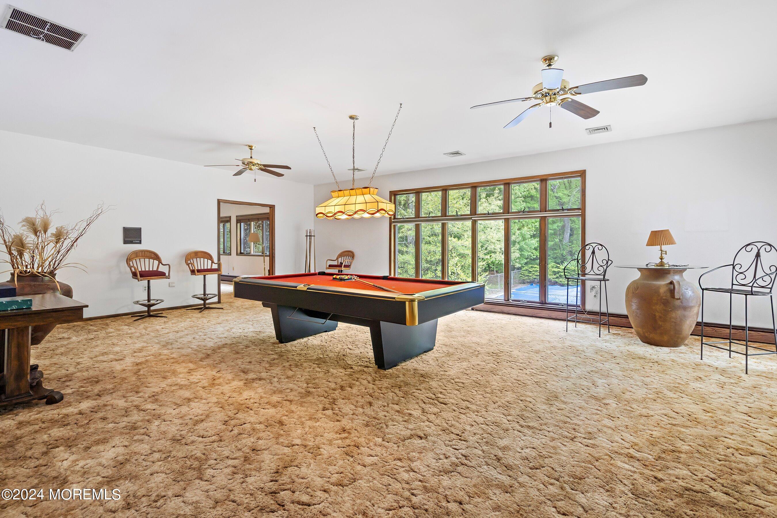 859 Monmouth Road Cream Ridge, NJ 08514 - Photo 34 of 50 a living room with furniture a window and a chandelier