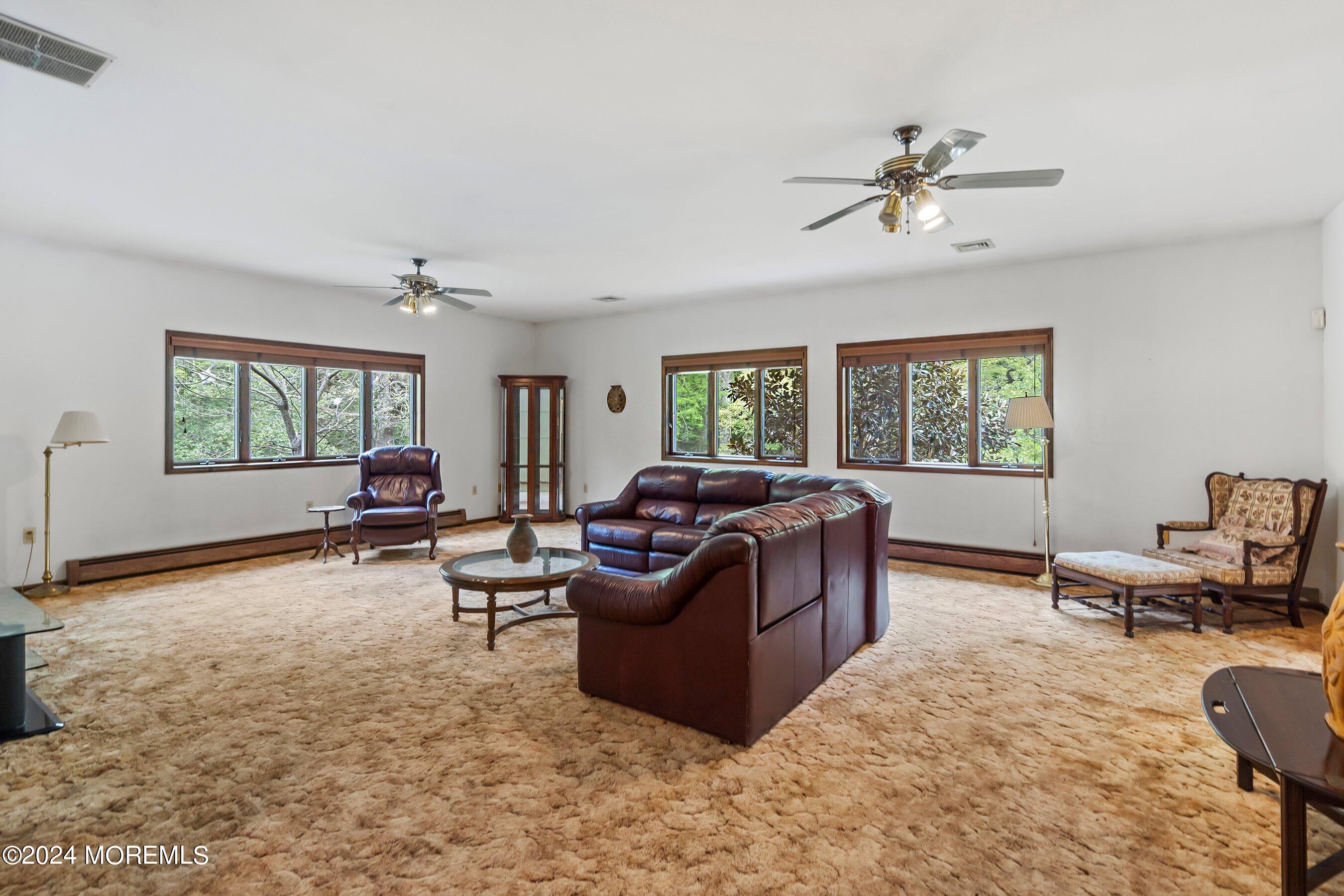 859 Monmouth Road Cream Ridge, NJ 08514 - Photo 35 of 50 a living room with furniture and a window