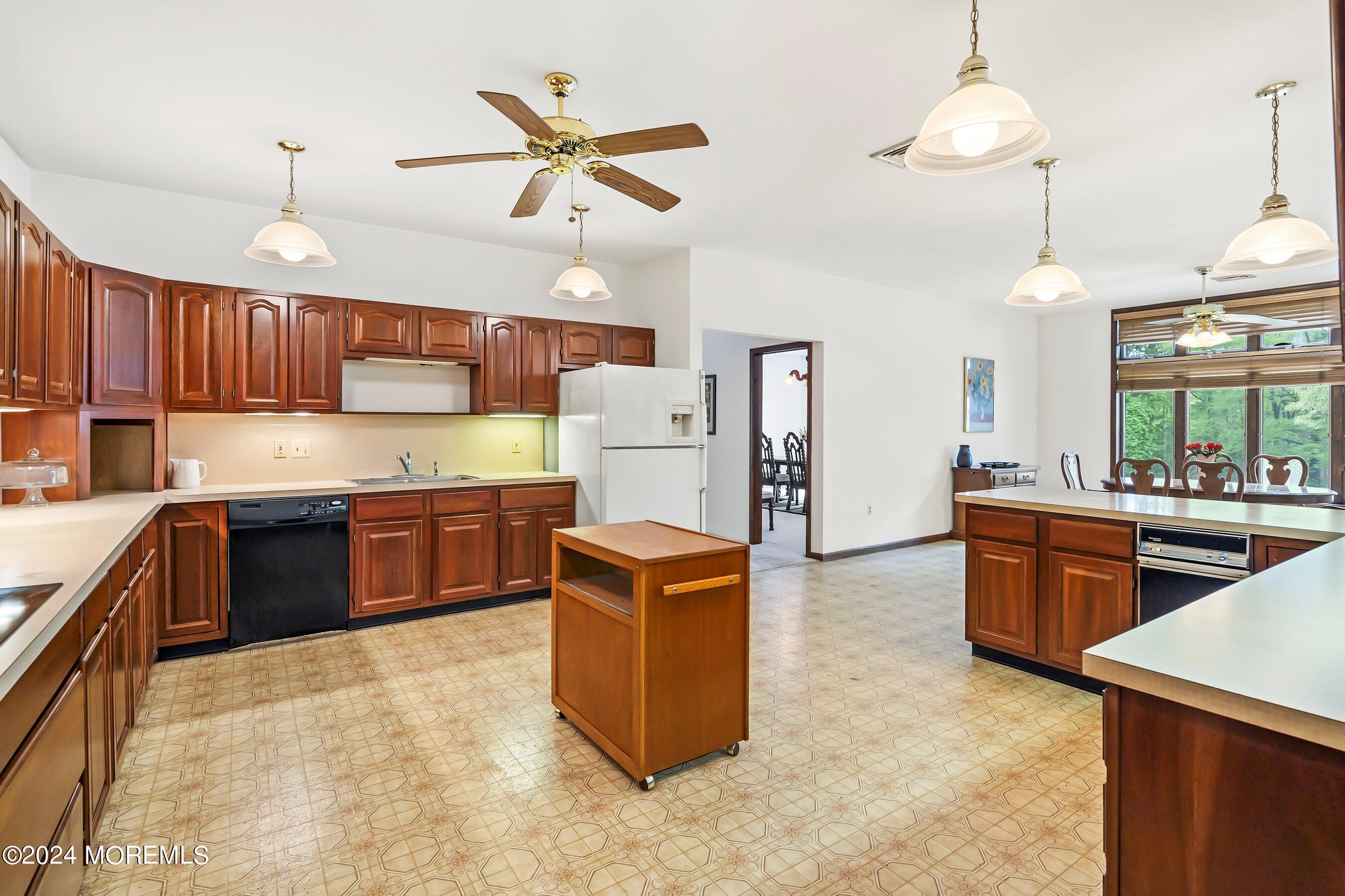 859 Monmouth Road Cream Ridge, NJ 08514 - Photo 7 of 50 a kitchen with stainless steel appliances granite countertop a stove refrigerator a sink a center island a stove and a cabinets