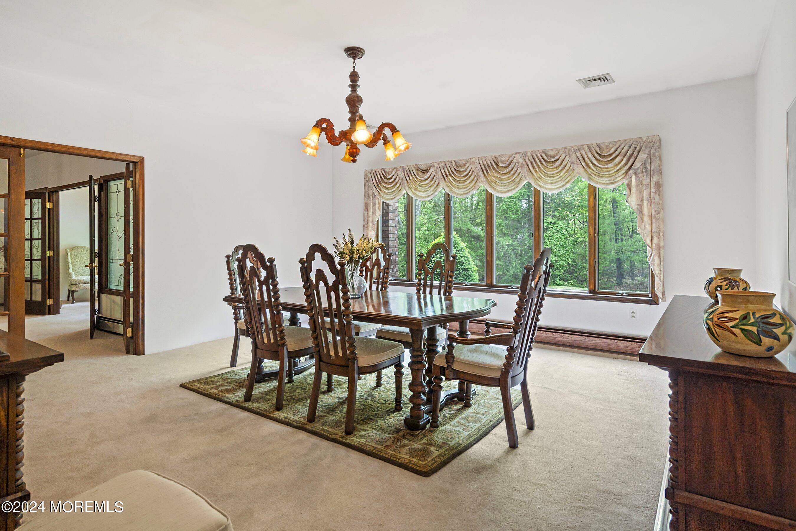 859 Monmouth Road Cream Ridge, NJ 08514 - Photo 9 of 50 a view of a dining room with furniture window and outside view