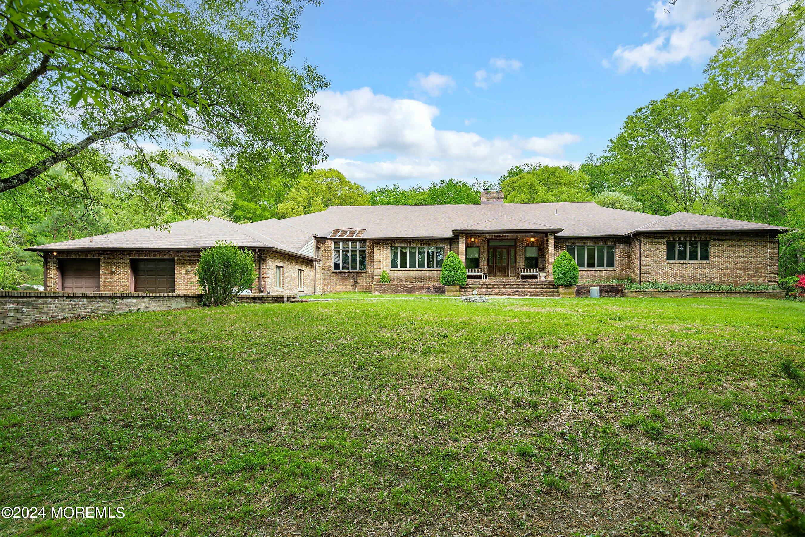 859 Monmouth Road Cream Ridge, NJ 08514 - Photo 10 of 50 a view of a house with a yard