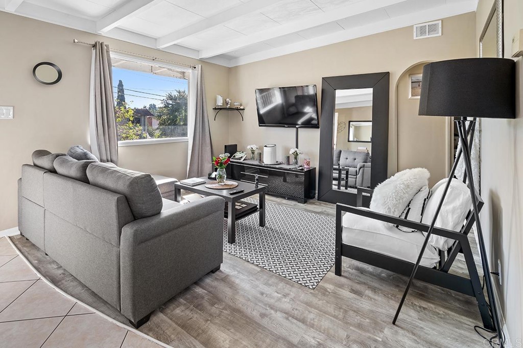 230 North Mission Road Fallbrook, CA 92028 - Photo 1 of 1 a living room with furniture and a lamp