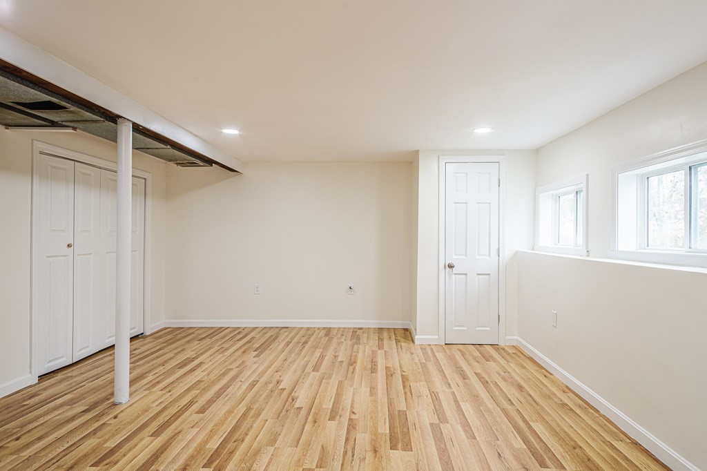 39 Kalmia Road Holbrook, MA 02343 - Photo 23 of 32 a view of a room with wooden floor and white walls