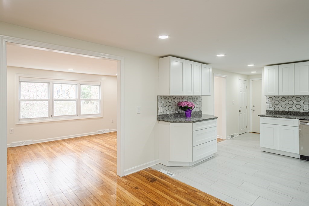 39 Kalmia Road Holbrook, MA 02343 - Photo 3 of 32 a open kitchen with granite countertop white cabinets sink and white appliances