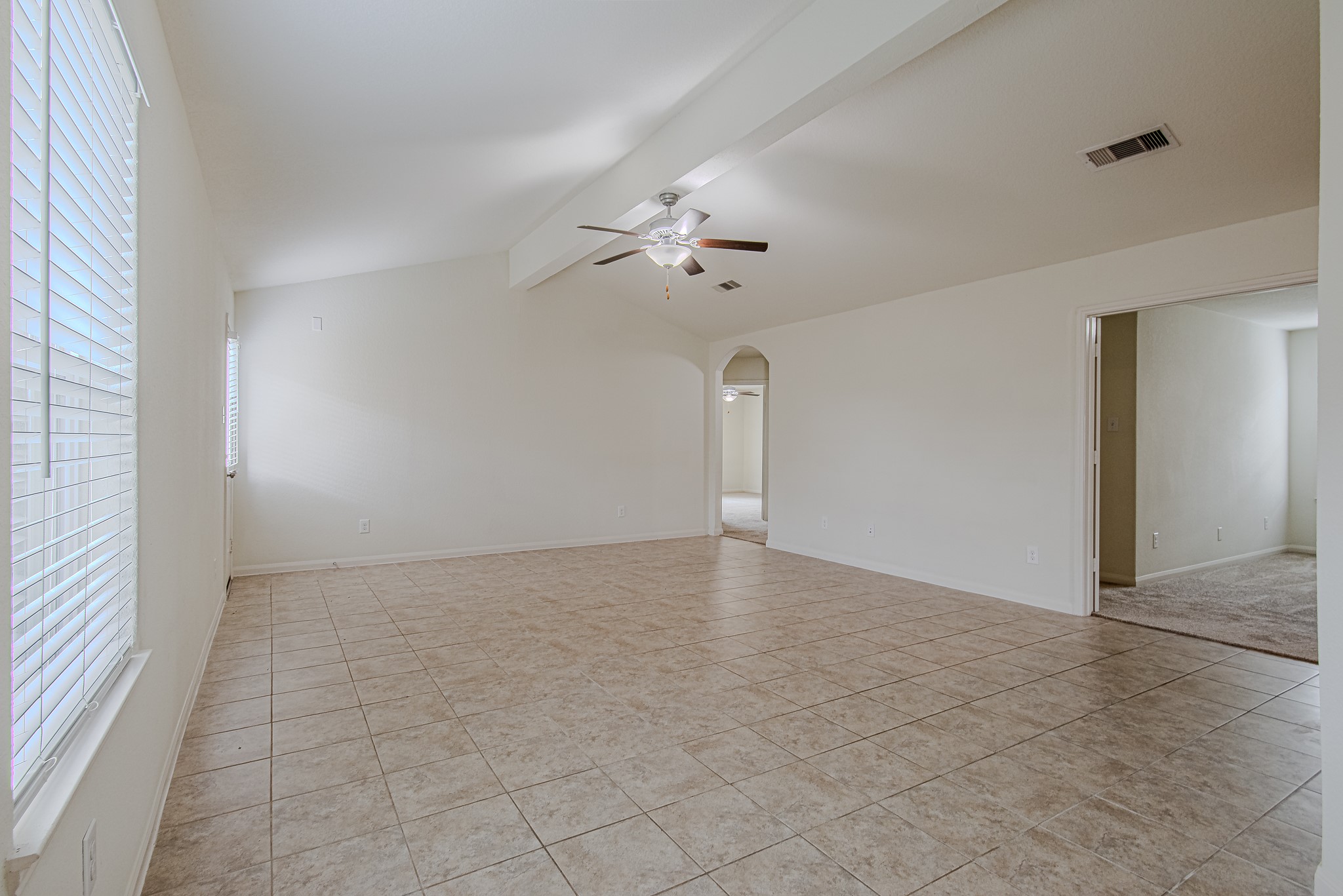 9522 Olive Stone Drive Rosharon, TX 77583 - Photo 6 of 29 wooden floor in an empty room with a window