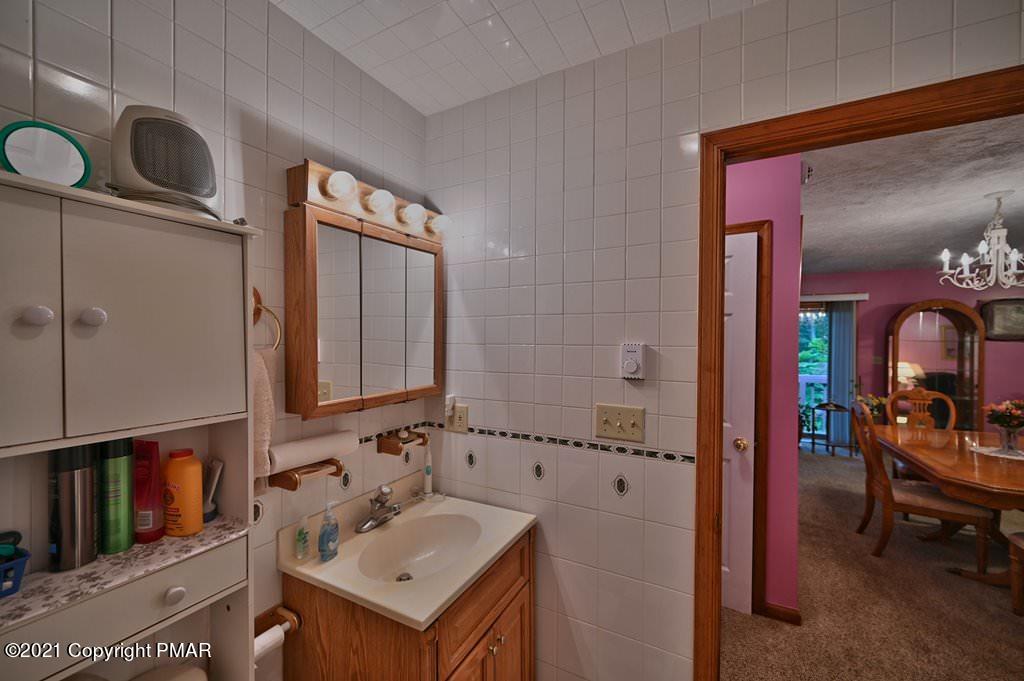 1607 Cotswald Road Tobyhanna, PA 18466 - Photo 25 of 61 a bathroom with a sink and a mirror