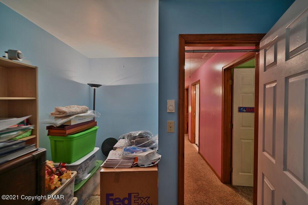 1607 Cotswald Road Tobyhanna, PA 18466 - Photo 30 of 61 a room that has a couch and a stove