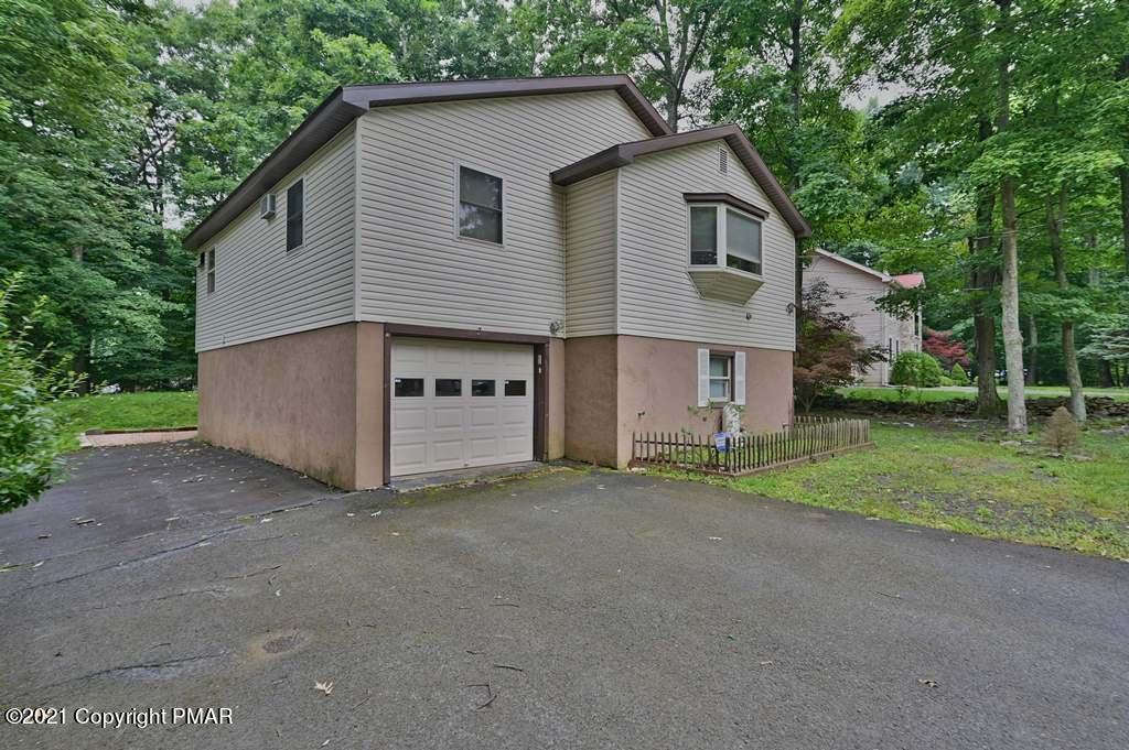 1607 Cotswald Road Tobyhanna, PA 18466 - Photo 31 of 61 a view of a house with a yard and large tree