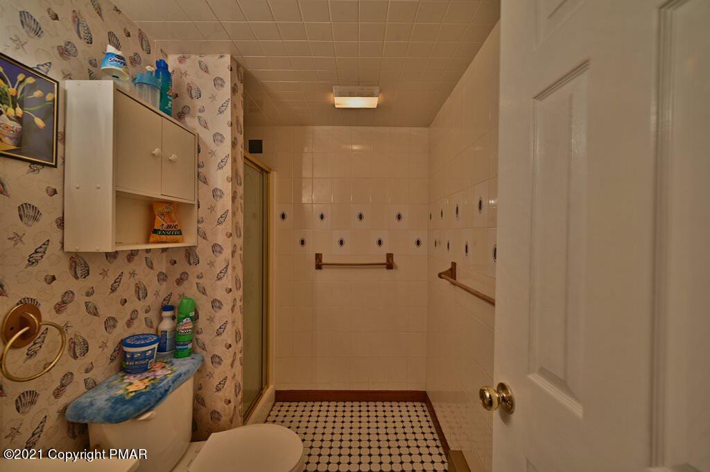 1607 Cotswald Road Tobyhanna, PA 18466 - Photo 36 of 61 a bathroom with a sink toilet and shower