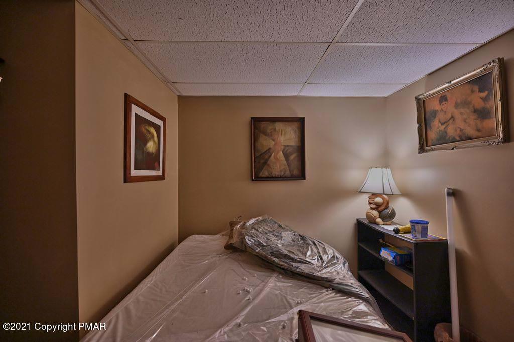 1607 Cotswald Road Tobyhanna, PA 18466 - Photo 40 of 61 a bedroom with bed and wall painting
