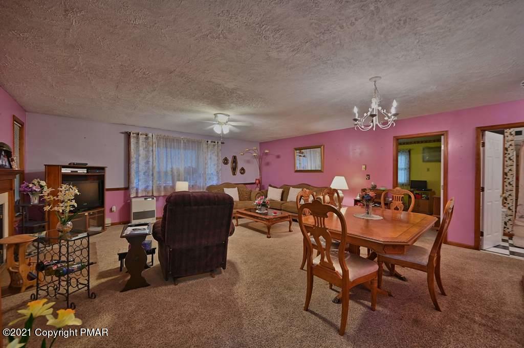 1607 Cotswald Road Tobyhanna, PA 18466 - Photo 10 of 61 a view of a dining room with furniture and chandelier