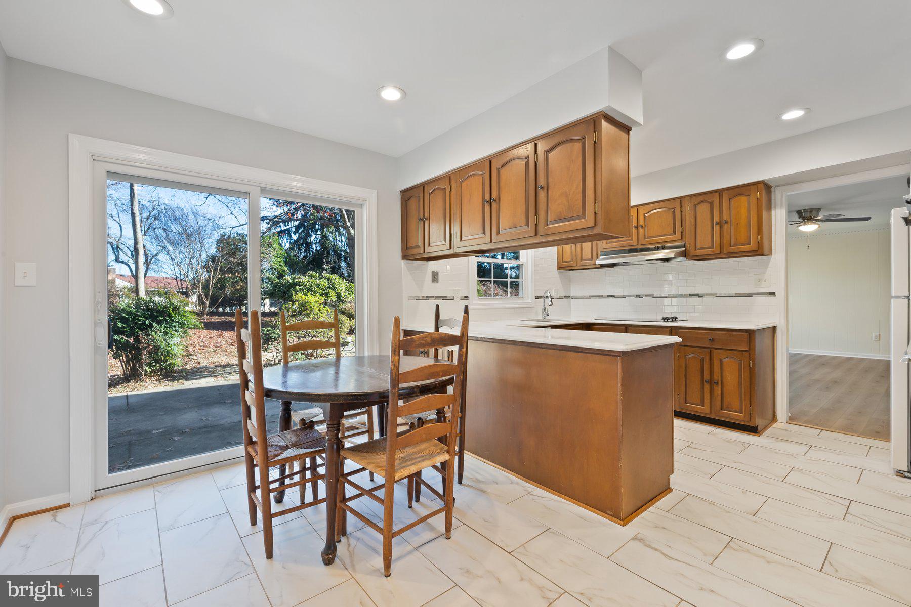 13817 Blair Stone Lane Silver Spring, MD 20906 - Photo 12 of 53 Tablespace kitchen with access to patio
