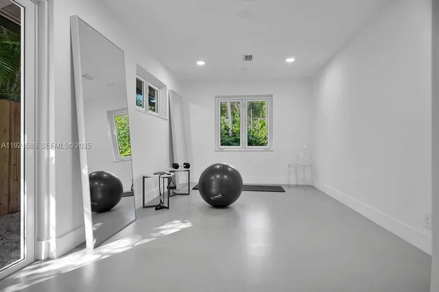 a bedroom with bed and a window