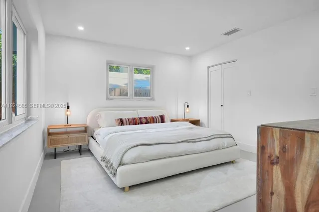 a view of staircase with white walls