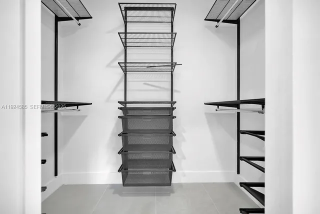 a bathroom with a toilet a sink and shower