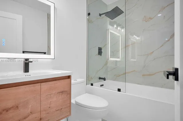 a bedroom with a bed lamp and a window