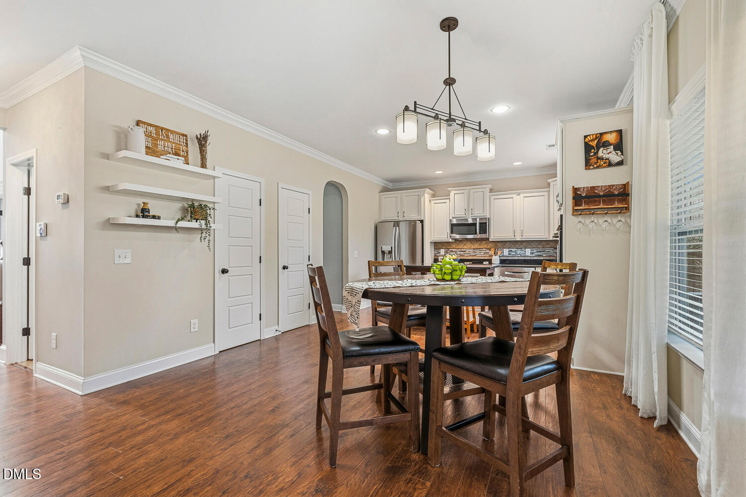 5933 Rounder Lane Holly Springs, NC 27540 - Photo 11 of 45 a view of a dining room with furniture window and wooden floor
