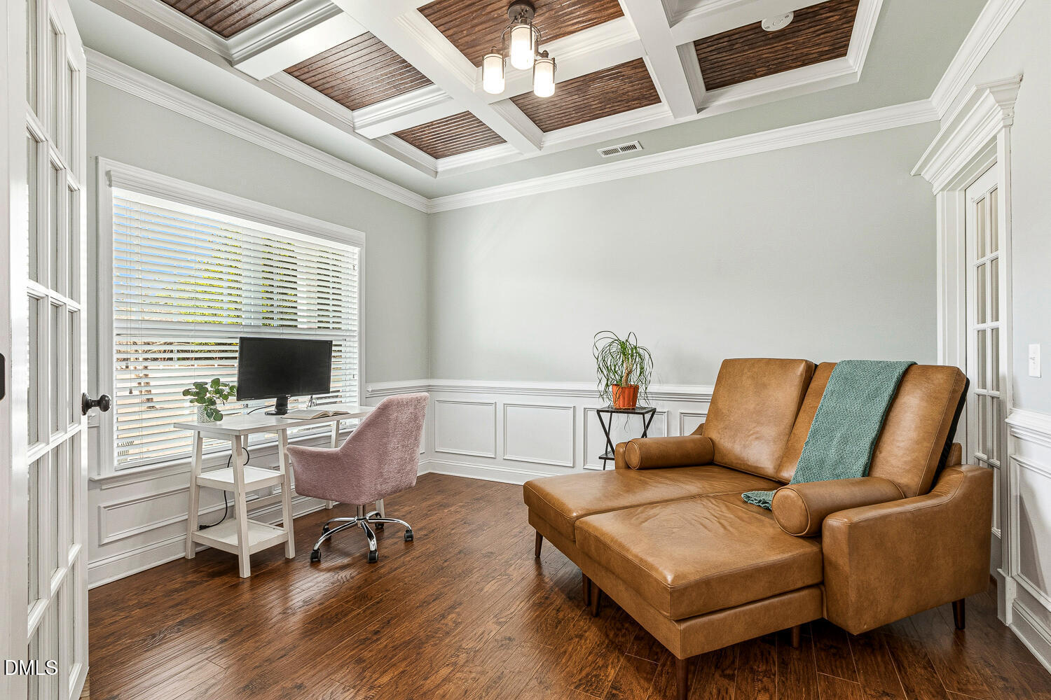 5933 Rounder Lane Holly Springs, NC 27540 - Photo 17 of 45 a living room with furniture wooden floor and a flat screen tv