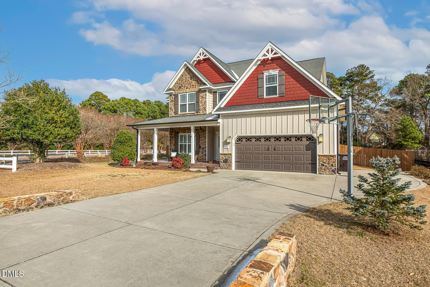 5933 Rounder Lane Holly Springs, NC 27540 - Photo 2 of 45 a front view of a house with a yard and garage