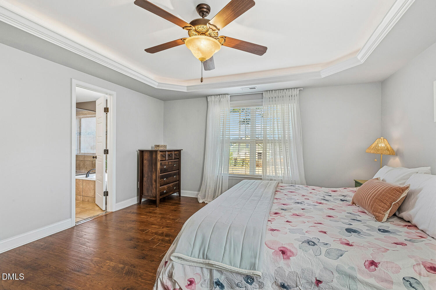 5933 Rounder Lane Holly Springs, NC 27540 - Photo 24 of 45 a bedroom with a bed and wooden floor