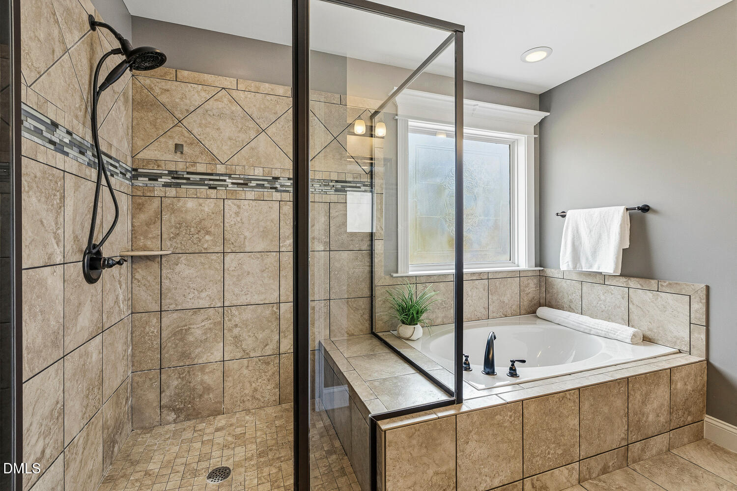 5933 Rounder Lane Holly Springs, NC 27540 - Photo 26 of 45 a bathroom with a tub and shower