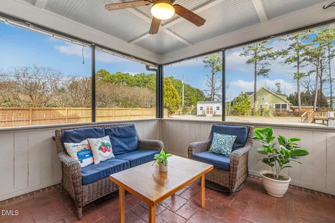 a living room with large windows