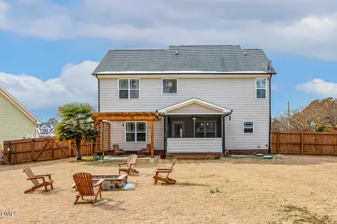 a view of outdoor space with swimming pool and furniture