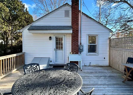 a house view with a outdoor seating