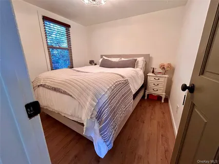 a bedroom with bed and window