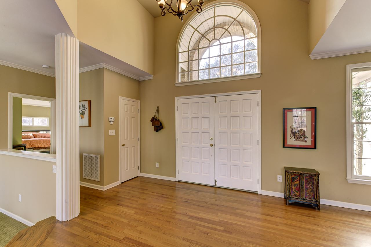 12312 Galway Drive Raleigh, NC 27613 - Photo 2 of 25 The two-story foyer greets you with double front doors, warm hardwood floors, and a chandelier. Foyer