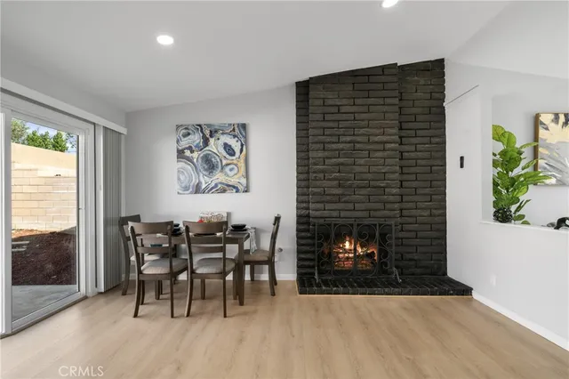 a dining room with furniture and fireplace