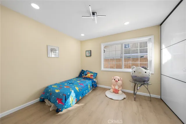 a bedroom with furniture and a window