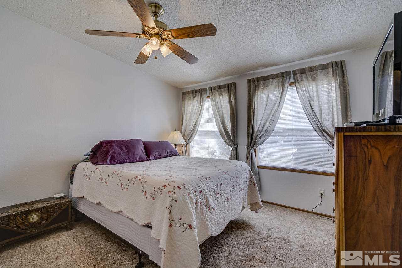 600 Theobald Reno, NV 89521 - Photo 16 of 25 a bedroom with a bed dresser and a window