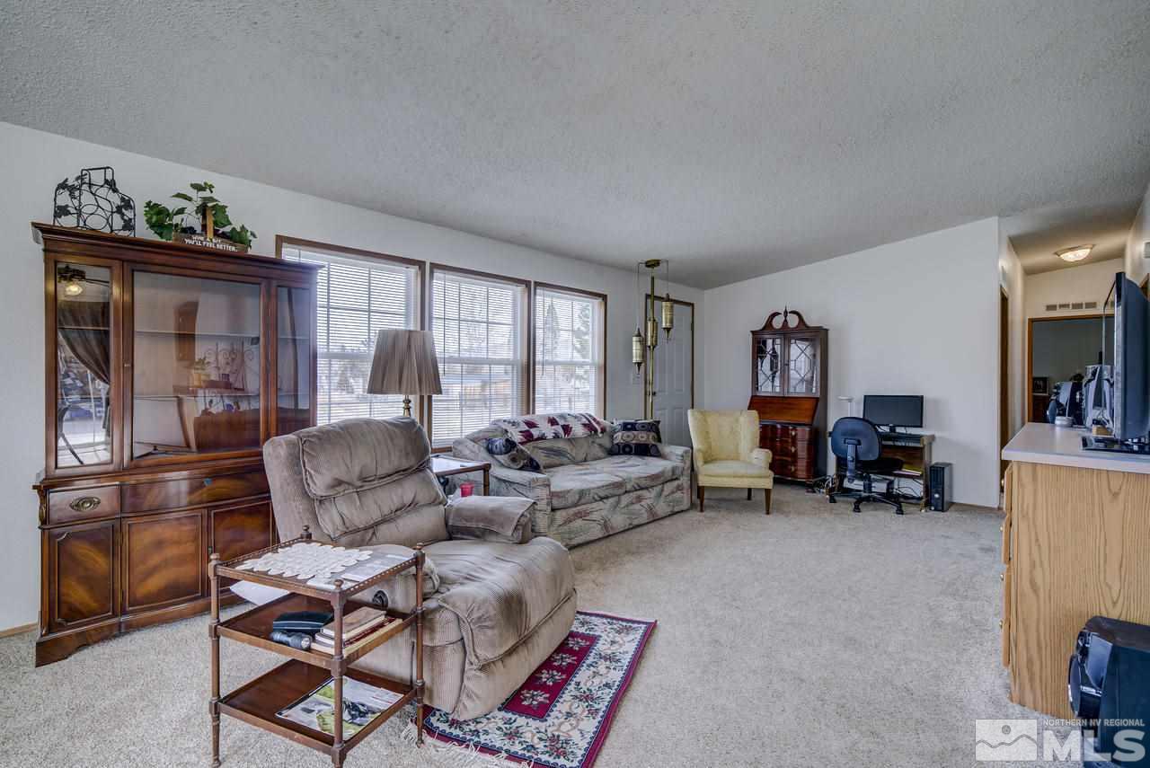 600 Theobald Reno, NV 89521 - Photo 8 of 25 a living room with furniture and a large window