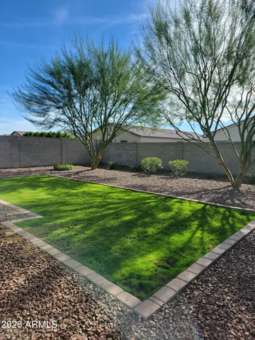 a view of a lake with a yard