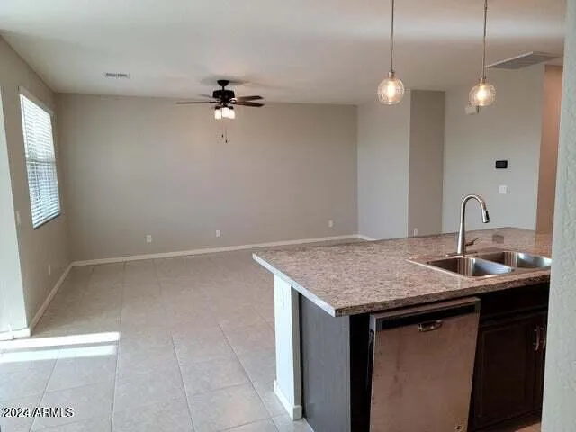 a bathroom with a granite countertop sink a mirror and vanity