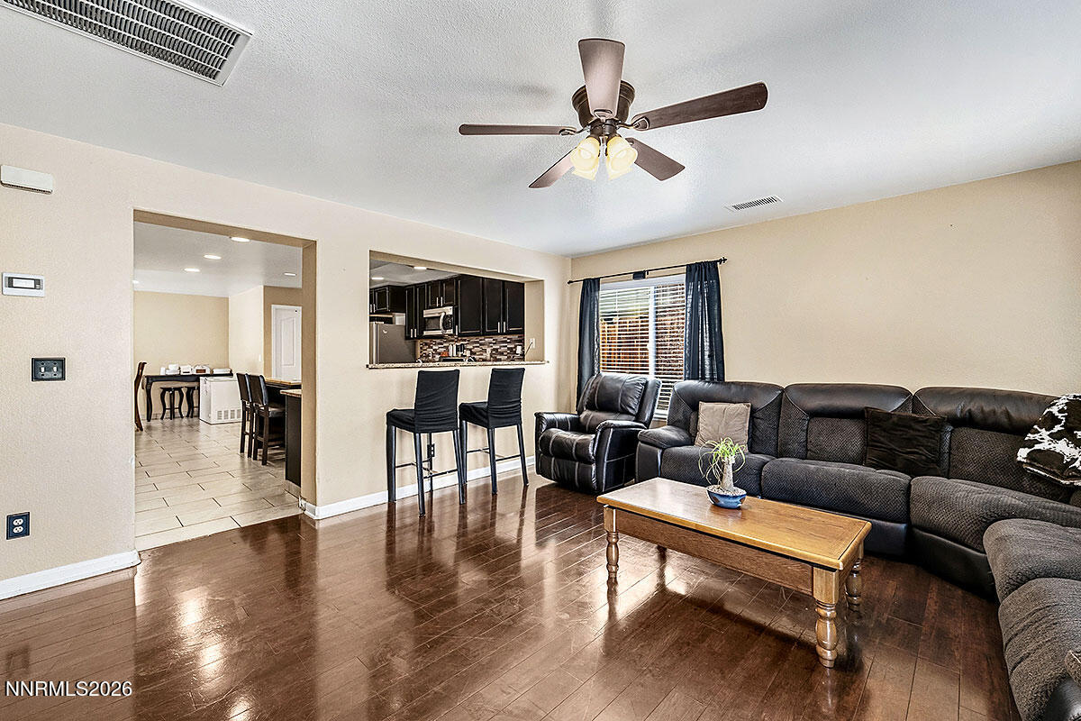 11365 Torino Way Reno, NV 89521 - Photo 11 of 29 a living room with furniture and a wooden floor