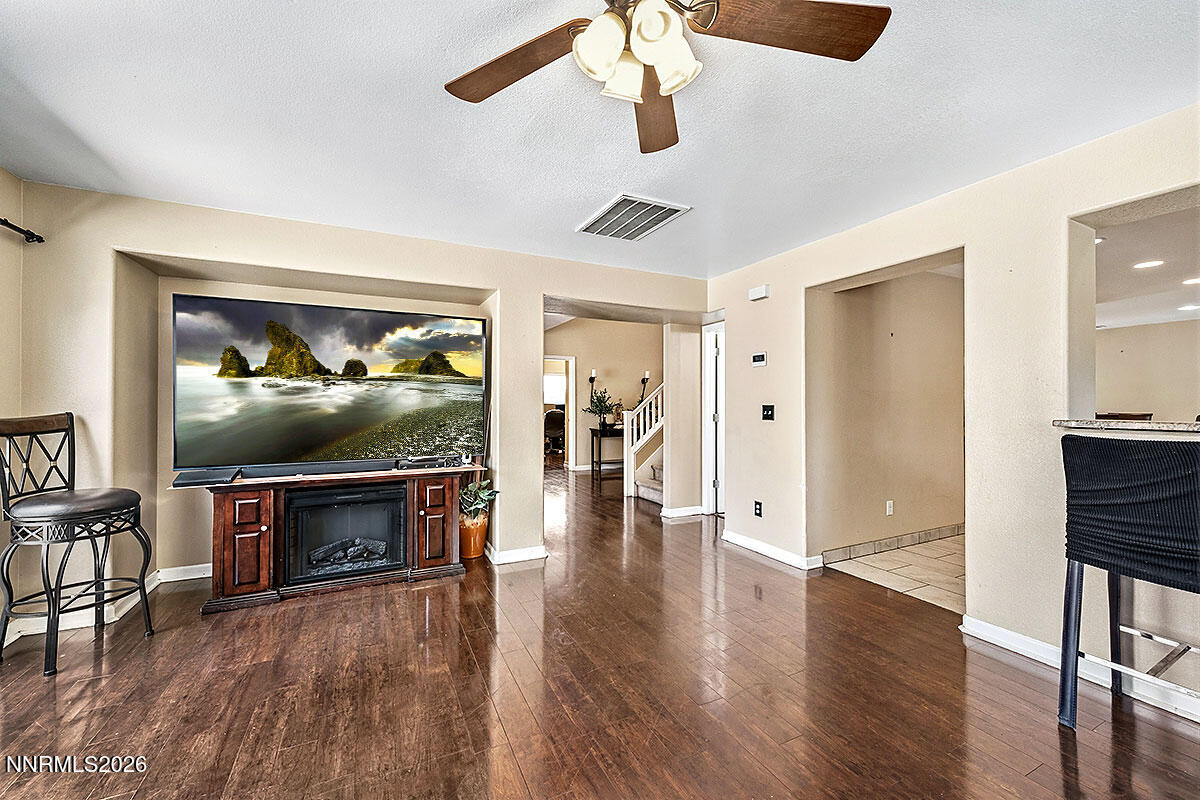 11365 Torino Way Reno, NV 89521 - Photo 13 of 29 a view of livingroom with furniture wooden floor and window