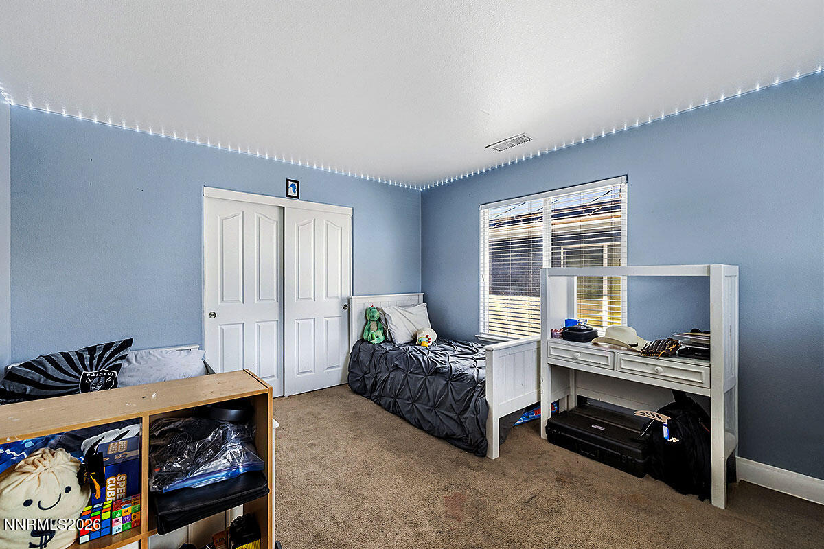11365 Torino Way Reno, NV 89521 - Photo 18 of 29 a bedroom with furniture and a window
